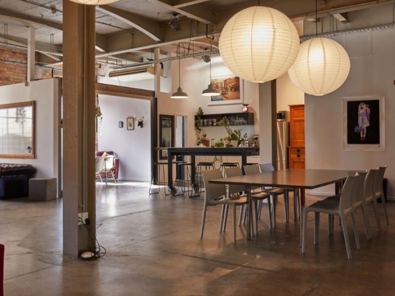 Desks in beautiful warehouse office space image 1